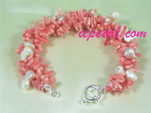 Twisted cultured pearl bracelet with red coral in wholesale