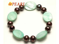 shell bracelet in green color with black button pearls