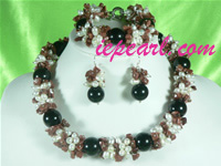 white rice shaped pearl necklace set with red stone beads